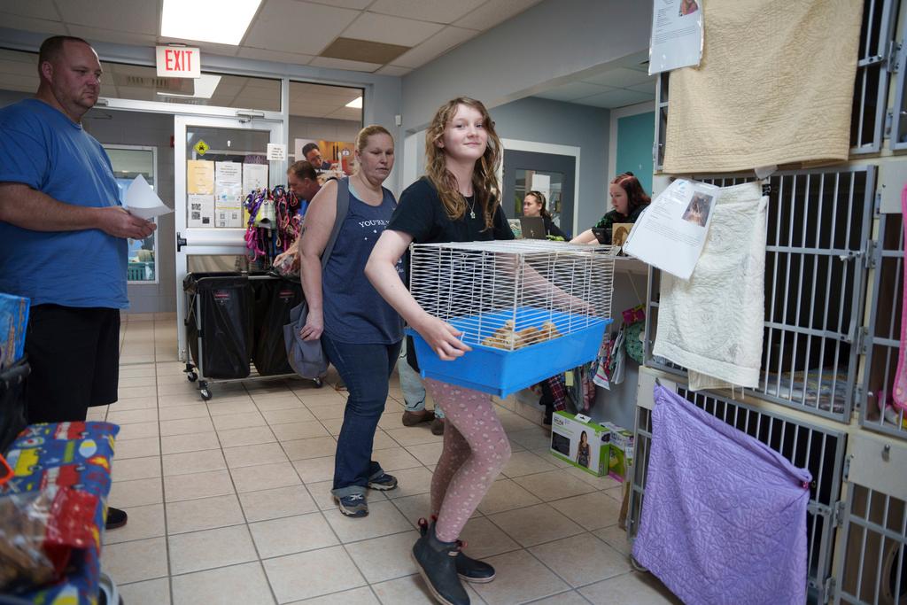 The Bruzdzinski family adopt chicks at First State Animal Center and SPCA in Camden, Del. 