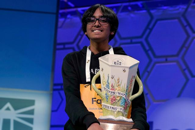 Faizan Zaki, 13, of Dallas, holds the trophy after winning the 2025 Scripps National Spelling Bee at the Gaylord National Resort & Convention Center