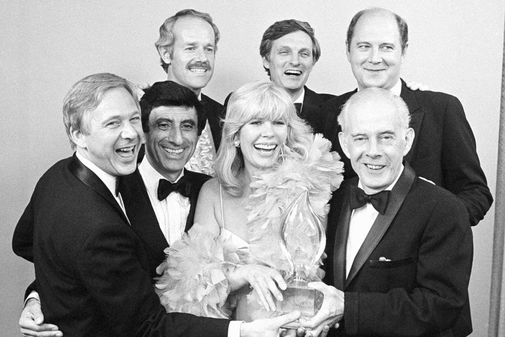 Cast members from "M*A*S*H," foreground from left, William Christopher, Jamie Farr, Loretta Swit and Henry Morgan, back row from left, Mike Farrell, Alan Alda and William Ogden Stiers, pose with their People's Choice Award for best comedy series in Santa Monica, Calif., on March 19, 1982.