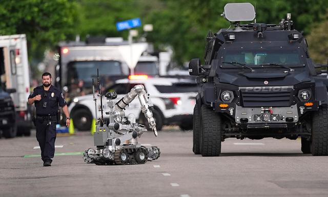 Law enforcement officials investigate after an attack on the Pearl Street Mall 