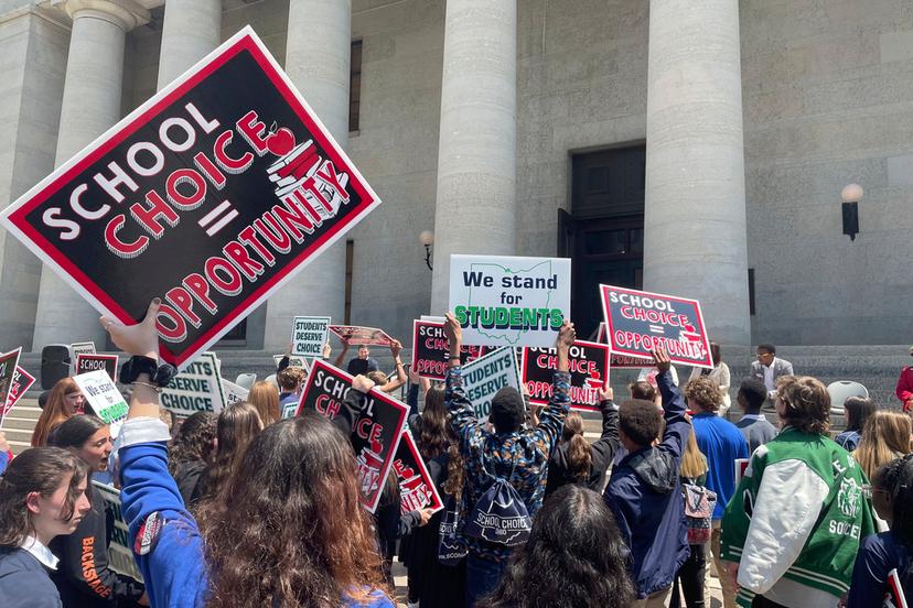 Students and parents rally at the Ohio Statehouse in support of possible changes that would increase eligibility for taxpayer-funded school vouchers to K-12 students statewide