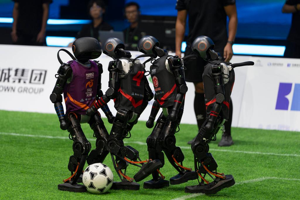 Teams compete using the T1 robots from Booster Robotics during the inaugural RoBoLeague robot soccer competition held in Beijing