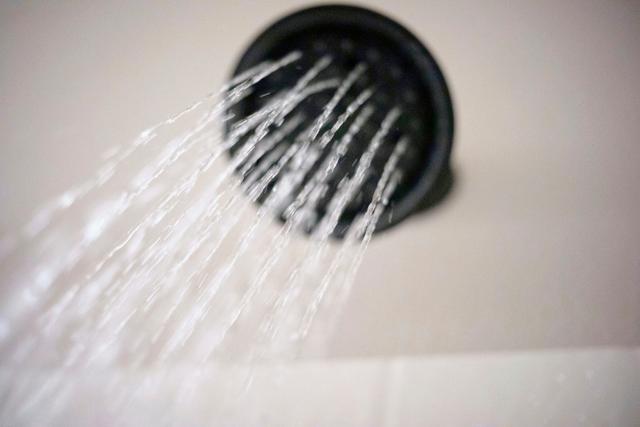 Water flows from a shower head