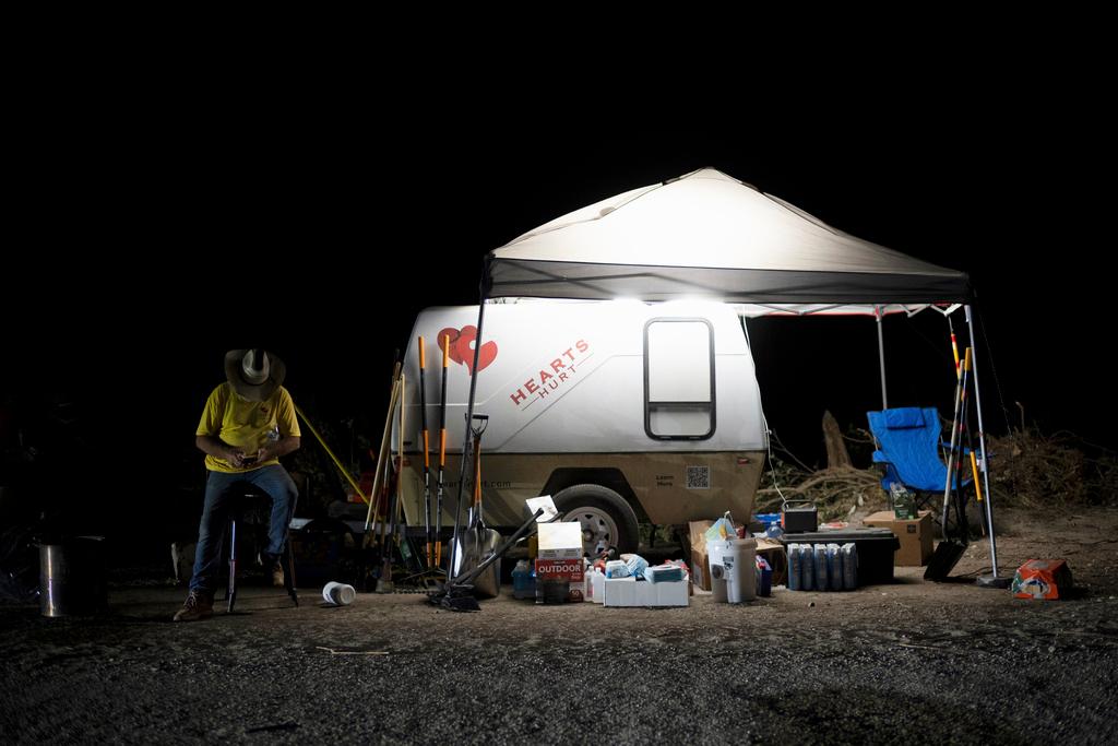 Dave Graham, a disaster relief minister from Ohio, sits near supplies he provides for first responders and others in need near Camp Mystic 