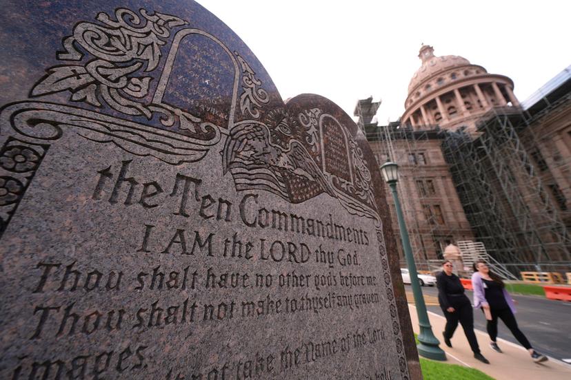 A granite Ten Commandments monument stands on the ground of the Texas Capitol