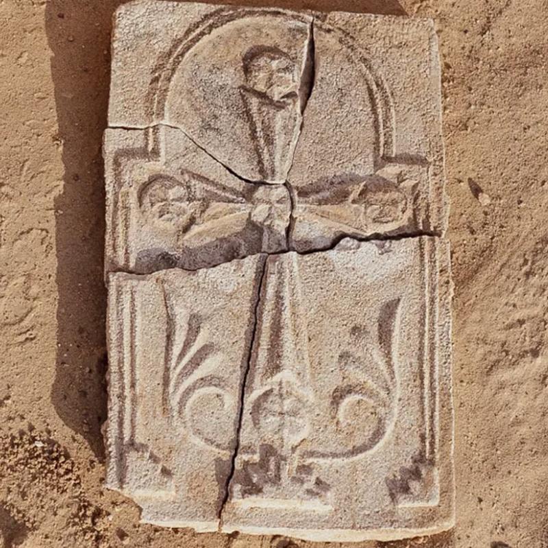 The object features what appears to be an image of a small stepped pyramid that may represent Golgotha