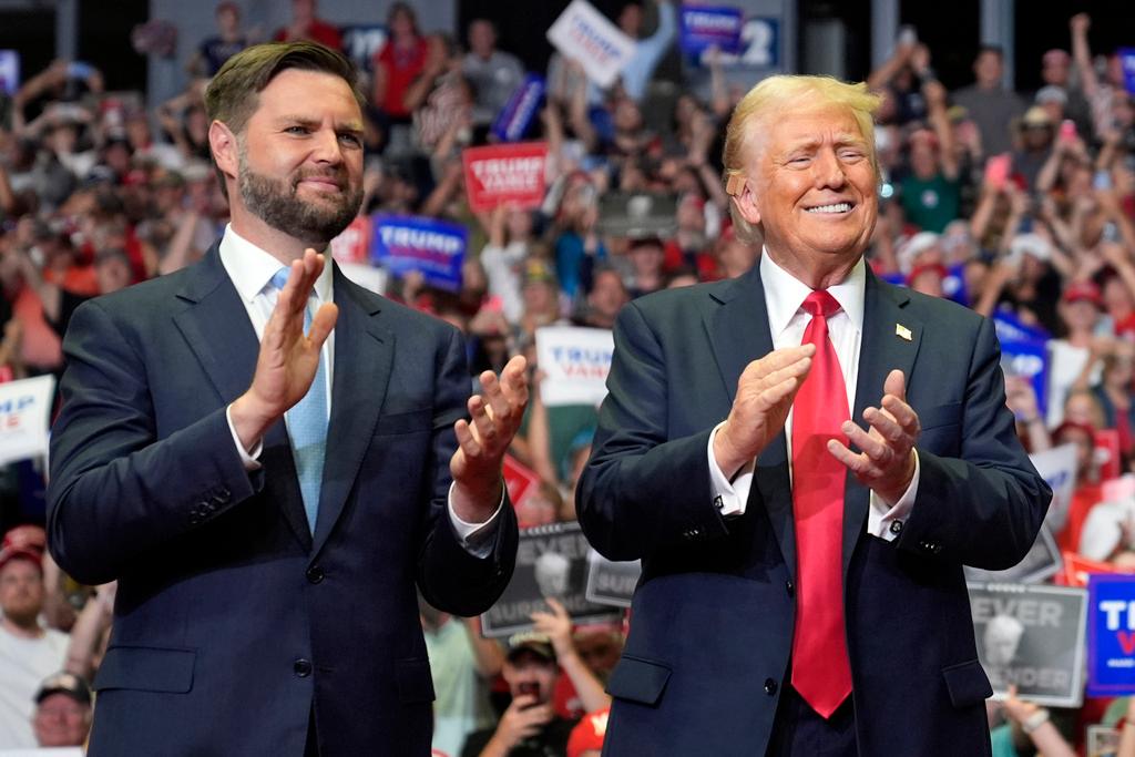 Republican presidential candidate former President Donald Trump and Republican vice presidential candidate Sen. JD Vance, R-Ohio, arrive a campaign rally in Grand Rapids, Mich. 