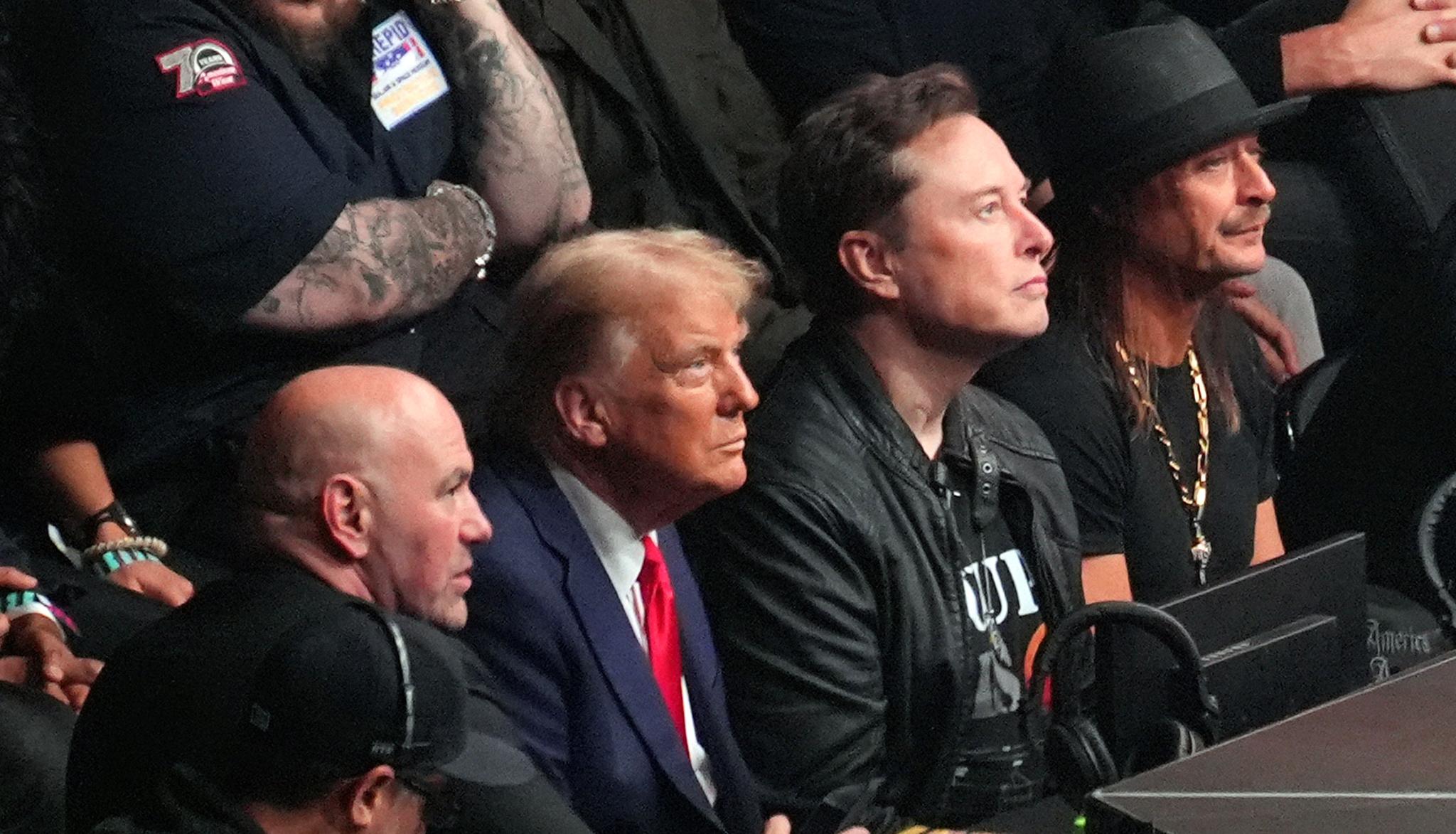 Pres-Elect Trump with three other men, ringside at a fight