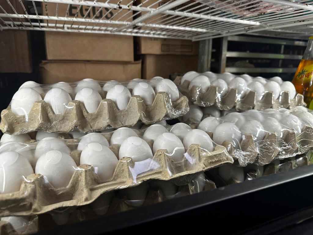 Cartons of eggs sit inside cooler at Norma's Sweets Bakery in New Orleans