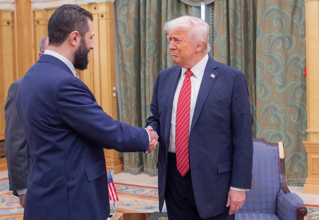 President Trump shakes hands with Syria's interim President Ahmad al-Sharaa, in Riyadh, Saudi Arabia