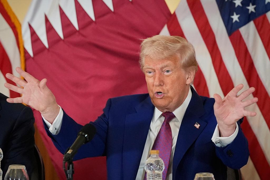 President Donald Trump gestures during a business roundtable in Doha, Qatar.