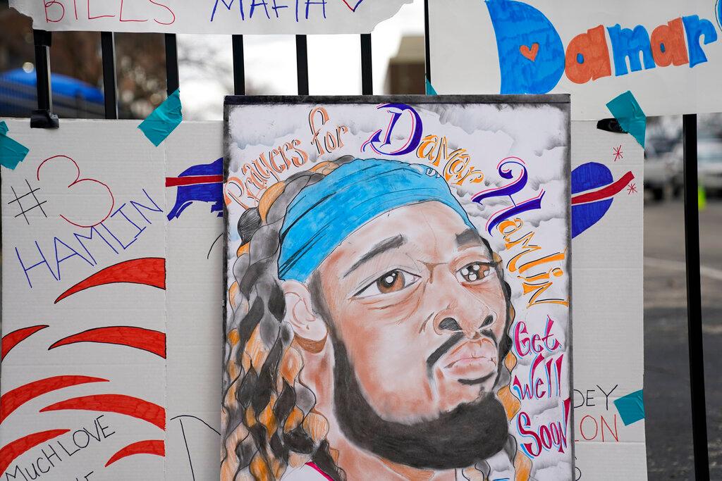 An artist's portrait of Buffalo Bills safety Damar Hamlin is displayed outside UC Medical Center, where Hamlin remains hospitalized