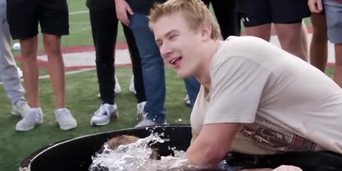 High school football players in Lebanon, Ohio, were baptized recently on the 50-yard-line of their football field. 