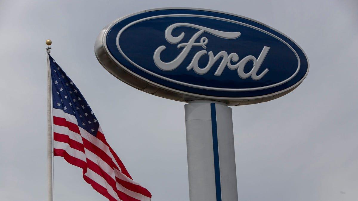 Ford sign and American flag