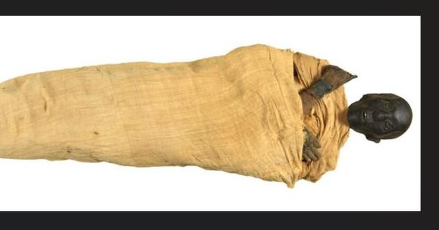 Mummy wrapped in yellow cloth