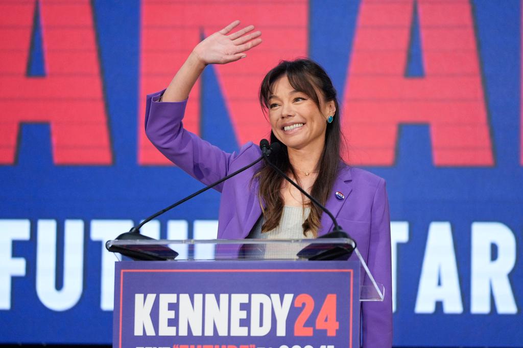Nicole Shanahan waves from the podium during a campaign event for Presidential candidate Robert F. Kennedy Jr.