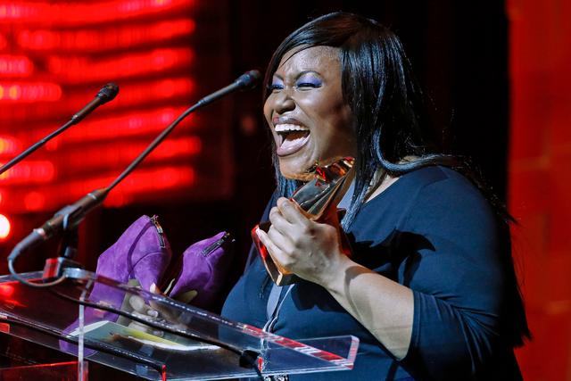 Mandisa accepts the award for pop/contemporary album of the year at the Dove Awards, 2014, in Nashville